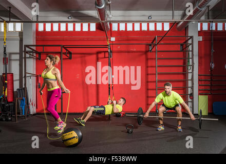 People in a gym doing Crossfit exercises. Stock Photo