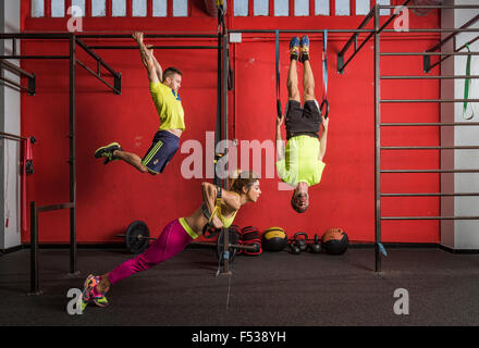 People in a gym doing Crossfit exercises. Stock Photo