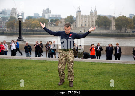 London, UK, 27th Oct, 2015. Rob Marshall, regional manager of North London and East Anglia joined Mayor of London, Boris Johnson, launching London Poppy Day by taking part in a Tug of War with armed forces outside City Hall. Credit:  Keith Larby/Alamy Live News Stock Photo