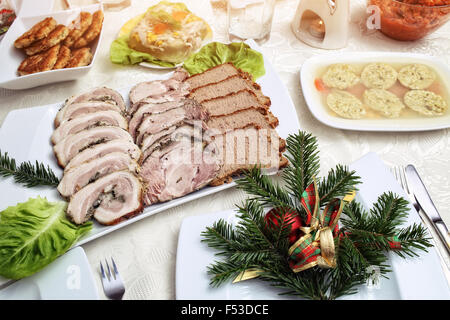 Baked sausage on the Christmas table Stock Photo