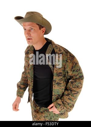 A young soldier in a camouflage uniform and olive green hat looking very serious, isolated on white background. Stock Photo