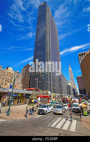 NEW YORK, USA - MAY 06, 2015: Corner of Eight Avenue and 33rd street in New York City with the Empire State Building skyscraper Stock Photo