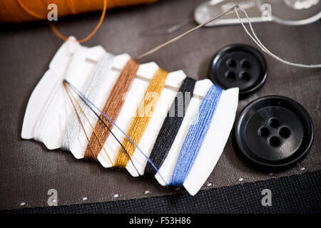 detail of sewing kit on the gray clothing Stock Photo