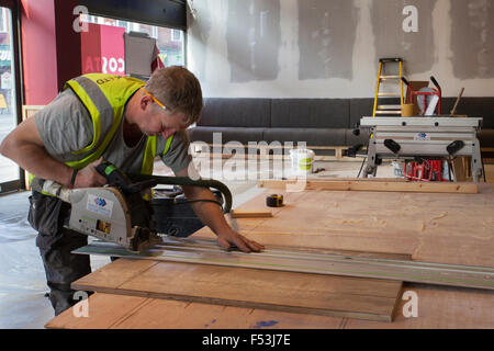 Costa Coffee Expansion & refurbishment, as shop fitters in a new Whitbread outlet prepare a new cafe bar due to open. Shopfitters are putting together the final finish to the corporate design which has proved so successful.   The Whitbread owned business plans to grow its UK store base to around 2,500 in 2020, up from 1,931. Costa’s UK sales rose 16.2% in the last year, for instance, with 4.6% growth in transactions per store. Stock Photo