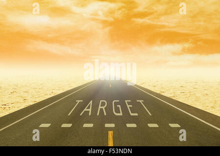 empty road through the desert with sign target on asphalt at sunset Stock Photo