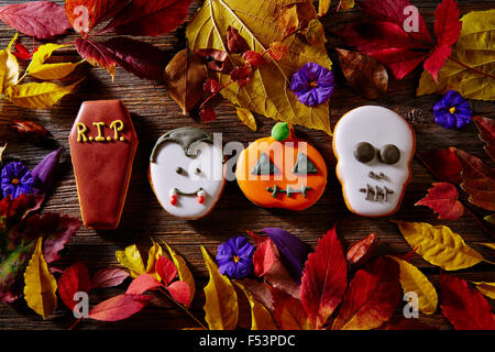Halloween sweets biscuits pumpkin skull vampire and tomb shapes Stock Photo