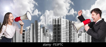 Businessman and woman with loudspeaker Stock Photo