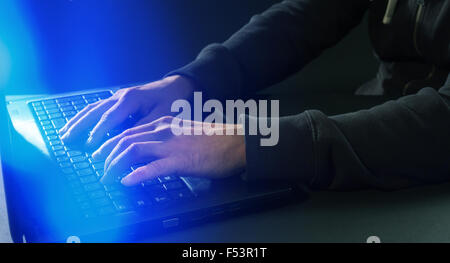 Man's hands typing on laptop keyboard concept Stock Photo