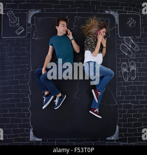 Young couple talking on the phone in bed. Stock Photo