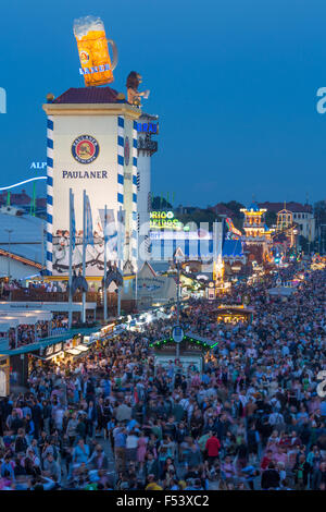 Visitors at Oktoberfest, Wies'n, Paulaner tower behind, beer tents, Munich, Bavaria, Germany Stock Photo