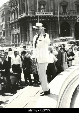 The American actor John Wayne walking in Rome , Italy Stock Photo - Alamy