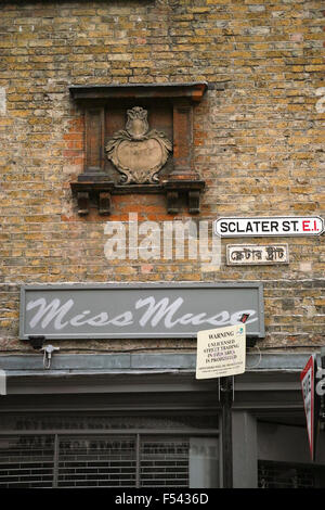 Historic and modern street sign in Sclater Street E1off Brick Lane in Spitalfields including 18th, 19th and 20th century signage Stock Photo