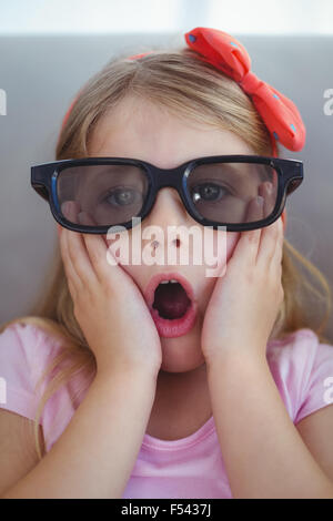 Close up of a girl wearing 3d glasses for a moive Stock Photo