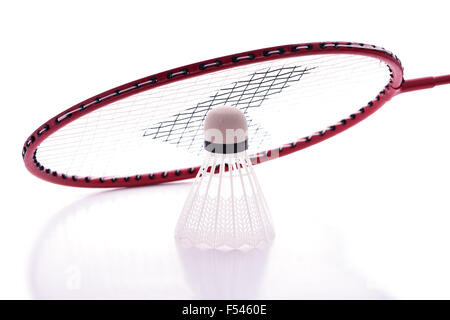 Badminton racket and shuttlecock with reflections against white background Stock Photo