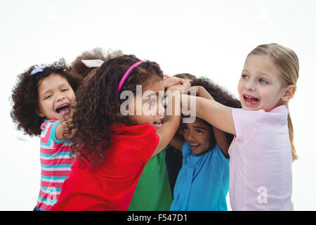 Small group of girls huddled together Stock Photo