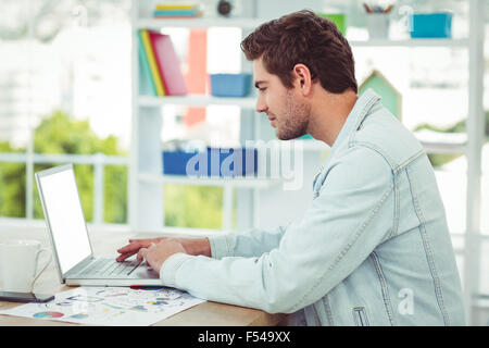 Creative businessman working on his laptop Stock Photo