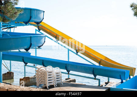 Blue and yellow curved plastic pipes in Croatia coast Stock Photo