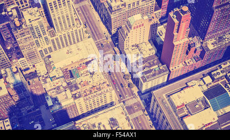 Vintage style aerial picture of Manhattan street with shadow of the Empire State Building, New York, USA. Stock Photo