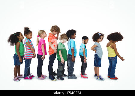 Group of kids standing in line, come covering mouths Stock Photo ...