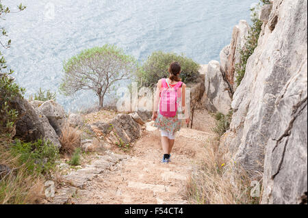 Person walking on a coastal path (sentier littoral) from Nice towards Villefrance sur Mer, Côte d'Azur, France Stock Photo