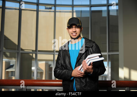 Portrait of ethnic college student inside building Stock Photo