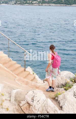 Person walking on a coastal path (sentier littoral) from Nice towards Villefrance sur Mer, Côte d'Azur, France Stock Photo