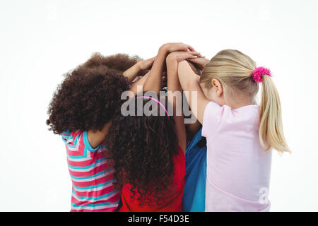 Small group of girls huddled together Stock Photo