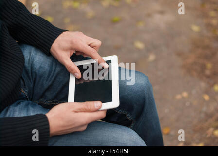 Man holding a tablet computer closeup. Stock Photo