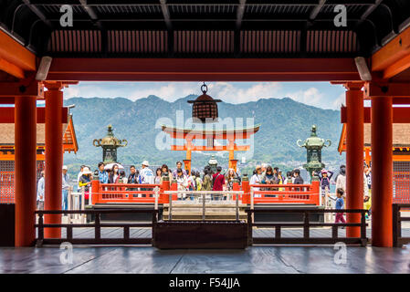 Miyajima, Japan - April 27, 2014: View of pilgrims visiting Itsukushima Shrine. Stock Photo