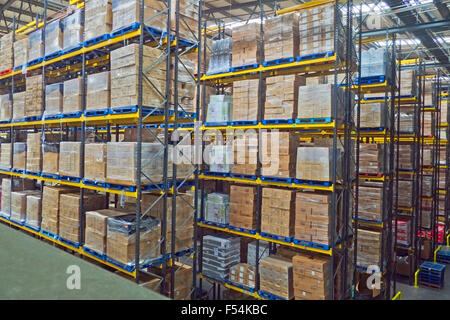 Lines of stacked pallets in warehouse UK Lines of stacked pallets in warehouse UK
