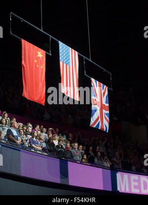 Glasgow, Scotland. 27th Oct, 2015. FIG Artistic Gymnastics World Championships. Day Five. The raising of the national flags during the Women's Team Final medal ceremony. Credit:  Action Plus Sports/Alamy Live News Stock Photo