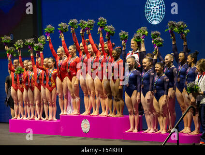 Glasgow, Scotland. 27th Oct, 2015. FIG Artistic Gymnastics World Championships. Day Five. The Gymnastics wave their flowers to the audience on the podium after receiving their medals. Credit:  Action Plus Sports/Alamy Live News Stock Photo