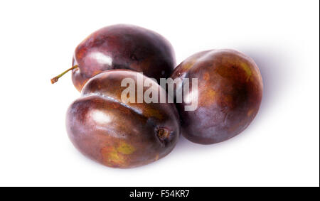 Three violet plums isolated on white background Stock Photo