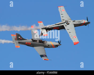 PZL-130 Orlik propeller powered trainer planes of the Polish Air Force flying in formation during an air display. Military aviation. Stock Photo