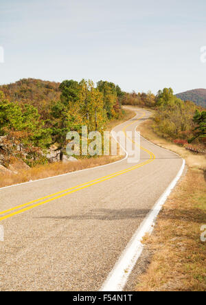 Talimena scenic byway winding on the crest of the mountain, with trees in fall colors Stock Photo
