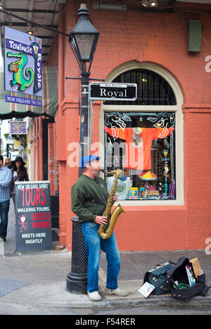 Jazz musician saxophonist plays saxophone in live performance on street corner, Royal Street, French Quarter, New Orleans, USA Stock Photo