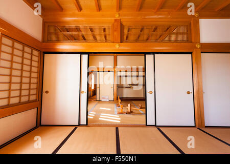 Japan, Tsuyama castle. A faithful reconstruction in the Bitchu Yagura turret of the daimyo's residence. Sliding doors opening into audience chamber. Stock Photo