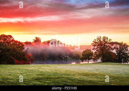 Sunrise over the lake on the Bowood estate in Wiltshire. Stock Photo