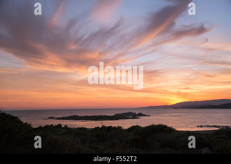 Scenic view of sea against cloudy sky during sunset Stock Photo