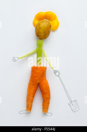 Figure made from vegetables with drawing background Stock Photo