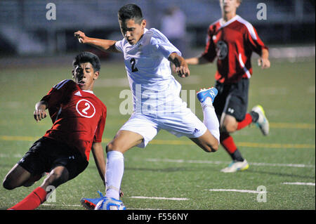 A high school player strives to get off a shot as a defender attempts to disrupt the effort from behind. USA. Stock Photo