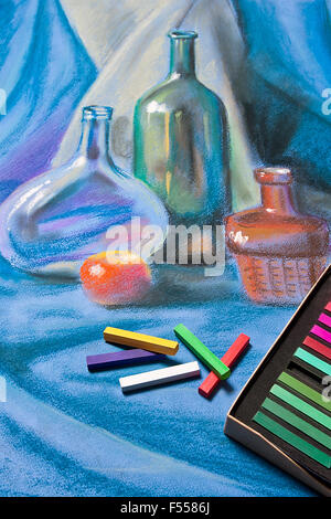 Soft pastels for artists and drawing paper on the wooden table