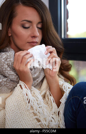 Flu. Closeup image of frustrated sick woman Stock Photo