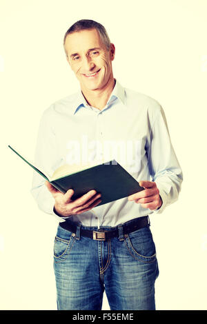 Handsome man reading his schedule Stock Photo