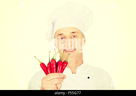 Male chef with chilli peppers Stock Photo