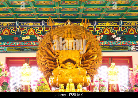 Thousand hands wooden Buddha in Chinese temple,Thailand Stock Photo