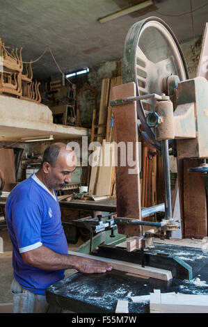Carpenter using wood cutter in workshop Saidon Lebanon Stock Photo