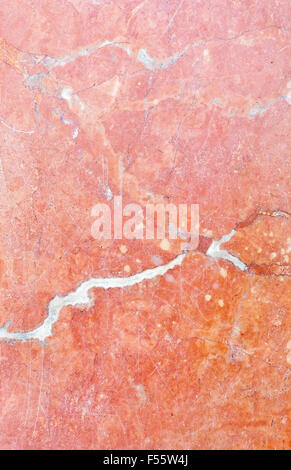Red marble tile surface with patina, organic texture background copy space. Stock Photo