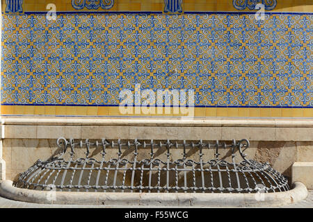Tiled wall and grill over basement window on the Central Market in Valencia, Spain Stock Photo