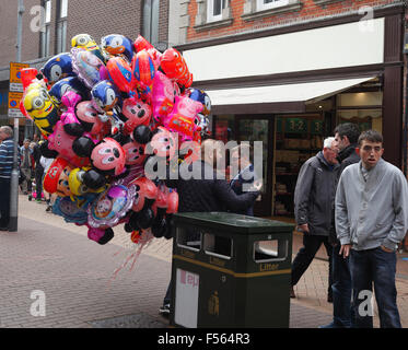 Man selling balloons on the street. Stock Photo